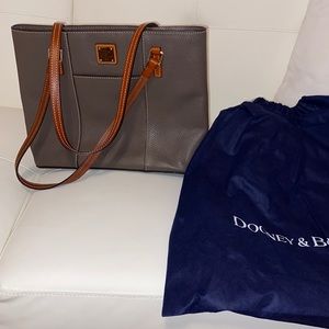 Dooney and Burke tote , measurement about 10” high x 13 wide , grey color.